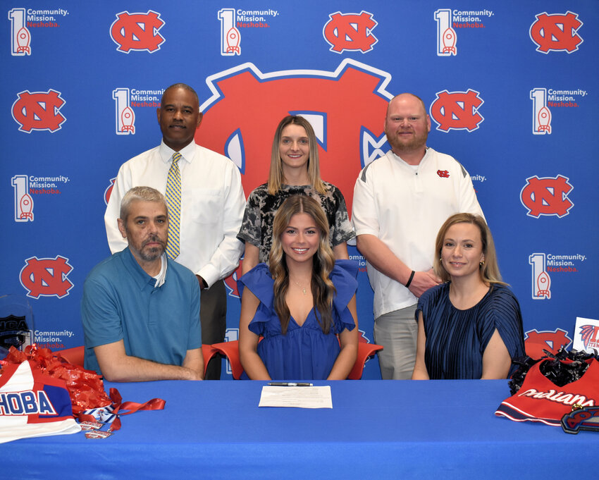 Pictured are, seated from left, Her dad Todd, Alicia, and her mother Kayla. (Back) Assistant Principal LaShon Horne, Cheer Coach Nikki Morrow, and Assistant Principal Brent Pouncey.